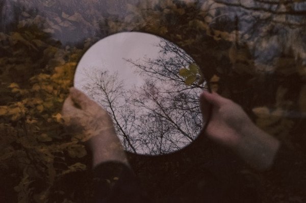 holding a mirror