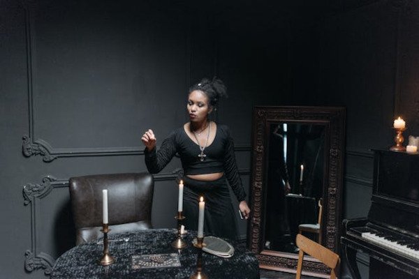 magician in frond of mirror